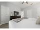 King-size bed, dresser, and large TV in a bedroom at 4803 Brier Rose Ln, Kissimmee, FL 34746