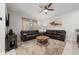 Living room with leather couches and a coffee table at 4803 Brier Rose Ln, Kissimmee, FL 34746
