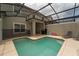 Private screened-in pool with lounge chairs and patio furniture at 4803 Brier Rose Ln, Kissimmee, FL 34746