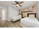 Bedroom with two twin beds, fun mural, and ample closet space at 4803 Brier Rose Ln, Kissimmee, FL 34746