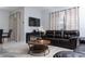 Living room with leather couches and a coffee table at 4803 Brier Rose Ln, Kissimmee, FL 34746