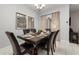 Dining area with seating for six and stylish decor at 4803 Brier Rose Ln, Kissimmee, FL 34746