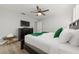 Main bedroom with king-size bed, dresser and TV at 4803 Brier Rose Ln, Kissimmee, FL 34746
