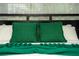Green pillows and blanket on a bed in a bedroom at 4803 Brier Rose Ln, Kissimmee, FL 34746