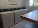Shared laundry room with multiple washers and dryers at 2860 N Powers Dr # 14, Orlando, FL 32818