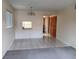 Living room with tile and carpet flooring, and a pass-through to kitchen at 2860 N Powers Dr # 14, Orlando, FL 32818