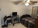 Small bedroom with a full-size bed and window at 241 N Hill Ave, Deland, FL 32724
