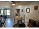 Combined dining and living area with kitchen access at 241 N Hill Ave, Deland, FL 32724