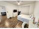 Comfortable bedroom with hardwood floors, a dresser and a TV at 4865 Cypress Woods Dr # 2204, Orlando, FL 32811