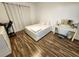 Bright bedroom with hardwood floors and a vanity at 4865 Cypress Woods Dr # 2204, Orlando, FL 32811