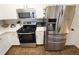 Modern kitchen with stainless steel appliances and white cabinets at 4865 Cypress Woods Dr # 2204, Orlando, FL 32811