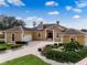 Luxury home with a large driveway and beautiful landscaping at 10843 Lakeshore Dr, Clermont, FL 34711