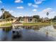 Lakefront property with a private dock and jet ski at 10843 Lakeshore Dr, Clermont, FL 34711