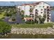 Aerial view of condo building with parking and waterfront access at 645 Marina Point Dr # 6450, Daytona Beach, FL 32114