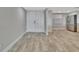 Bright entryway with wood-look tile floors and access to the kitchen at 645 Marina Point Dr # 6450, Daytona Beach, FL 32114