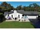 Aerial view of a house with a patio and a two car garage at 100 Dunshee Dr, Longwood, FL 32779