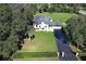 Aerial view of a house with a large yard and long driveway at 100 Dunshee Dr, Longwood, FL 32779