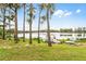 Enjoy waterfront living with a dock and string lights at 16837 Arrowhead Blvd, Winter Garden, FL 34787