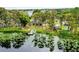 Lakefront home with dock and lush landscaping at 16837 Arrowhead Blvd, Winter Garden, FL 34787
