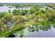 Aerial view showcasing waterfront property with dock and lake access at 16837 Arrowhead Blvd, Winter Garden, FL 34787