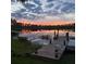 Serene lakeside dock at sunset, perfect for enjoying the view at 16837 Arrowhead Blvd, Winter Garden, FL 34787