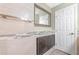 Bathroom with updated vanity, tiled shower, and linen storage at 16837 Arrowhead Blvd, Winter Garden, FL 34787
