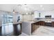 Open concept kitchen with dark hardwood floors and water view at 16837 Arrowhead Blvd, Winter Garden, FL 34787