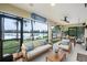 Spacious screened porch with comfortable seating and lake view at 16837 Arrowhead Blvd, Winter Garden, FL 34787
