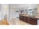 Updated kitchen featuring dark wood cabinets and granite countertops at 16837 Arrowhead Blvd, Winter Garden, FL 34787