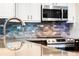 Close-up of kitchen faucet and granite countertop at 16837 Arrowhead Blvd, Winter Garden, FL 34787