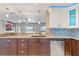 Modern kitchen with granite countertops and stainless steel appliances at 16837 Arrowhead Blvd, Winter Garden, FL 34787