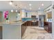 Updated kitchen with stainless steel appliances and breakfast bar at 16837 Arrowhead Blvd, Winter Garden, FL 34787