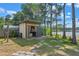 Outdoor patio with lake access and a firepit at 16837 Arrowhead Blvd, Winter Garden, FL 34787