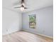 Bedroom with large window, ceiling fan, and neutral decor at 16837 Arrowhead Blvd, Winter Garden, FL 34787