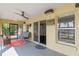 Relaxing screened porch with lake view, swing, and seating at 16837 Arrowhead Blvd, Winter Garden, FL 34787