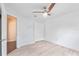 Bright bedroom with ceiling fan, ample closet space, and light-toned flooring at 16837 Arrowhead Blvd, Winter Garden, FL 34787