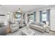 Light and airy living room with comfortable seating and lake views at 16837 Arrowhead Blvd, Winter Garden, FL 34787