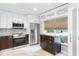 Updated kitchen with stainless steel appliances and wood cabinets at 16837 Arrowhead Blvd, Winter Garden, FL 34787