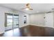 Bright bonus room with dark hardwood floors and sliding glass doors at 16837 Arrowhead Blvd, Winter Garden, FL 34787