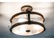 Modern ceiling light fixture with wood and glass accents at 16837 Arrowhead Blvd, Winter Garden, FL 34787