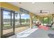 Enjoy lake views from this screened porch with seating at 16837 Arrowhead Blvd, Winter Garden, FL 34787