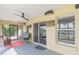 Covered patio with seating area, ceiling fan and access to backyard at 16837 Arrowhead Blvd, Winter Garden, FL 34787