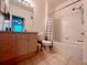 Bathroom with tub, shower, and updated vanity at 2302 Silver Palm Dr # 301, Kissimmee, FL 34747