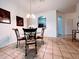 Charming dining area with glass-top table and four chairs at 2302 Silver Palm Dr # 301, Kissimmee, FL 34747