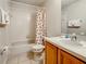 Bathroom featuring a tub, toilet and wood vanity at 702 Calabria Ave, Davenport, FL 33897