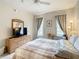 Bright bedroom featuring a large TV and ample dresser space at 702 Calabria Ave, Davenport, FL 33897