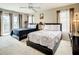 Bedroom with two beds, ceiling fan and access to balcony at 702 Calabria Ave, Davenport, FL 33897