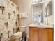 Clean bathroom with shower/tub combo and wood vanity at 702 Calabria Ave, Davenport, FL 33897