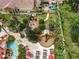 Resort-style amenities including pools, spa, playground, and lush landscaping at 702 Calabria Ave, Davenport, FL 33897