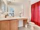 Clean bathroom with shower, tub, and wood vanity at 702 Calabria Ave, Davenport, FL 33897